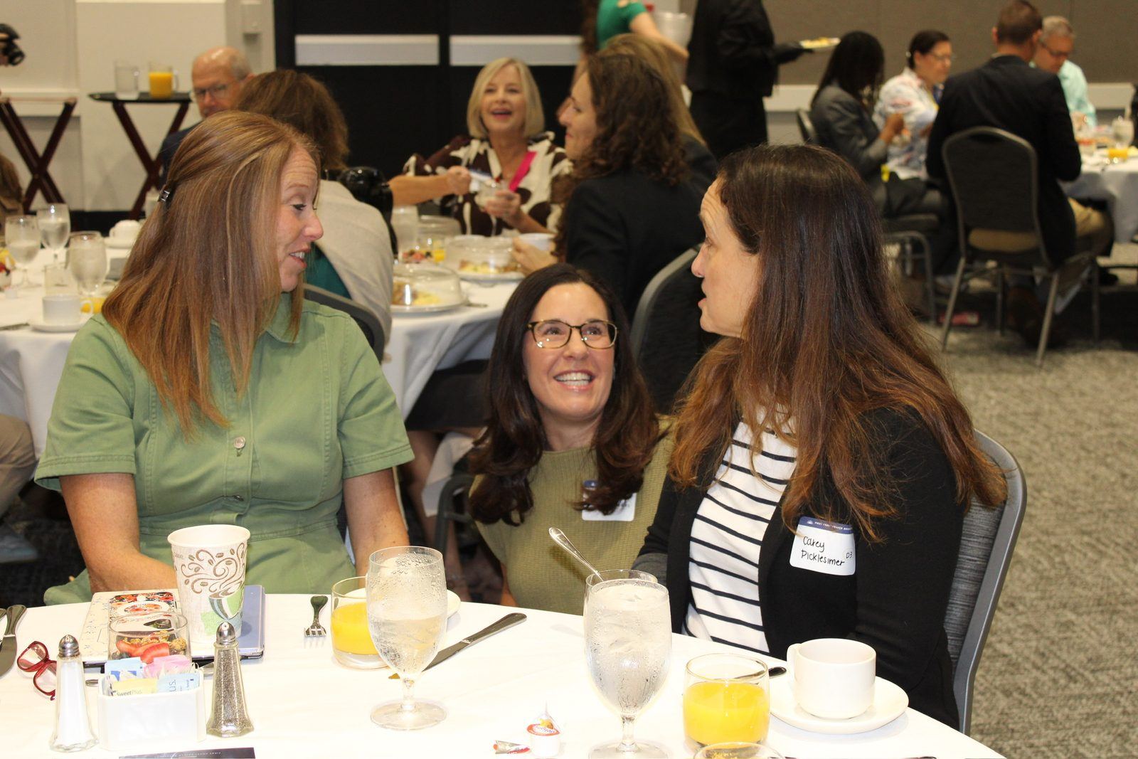 Guests talking around a breakfast table