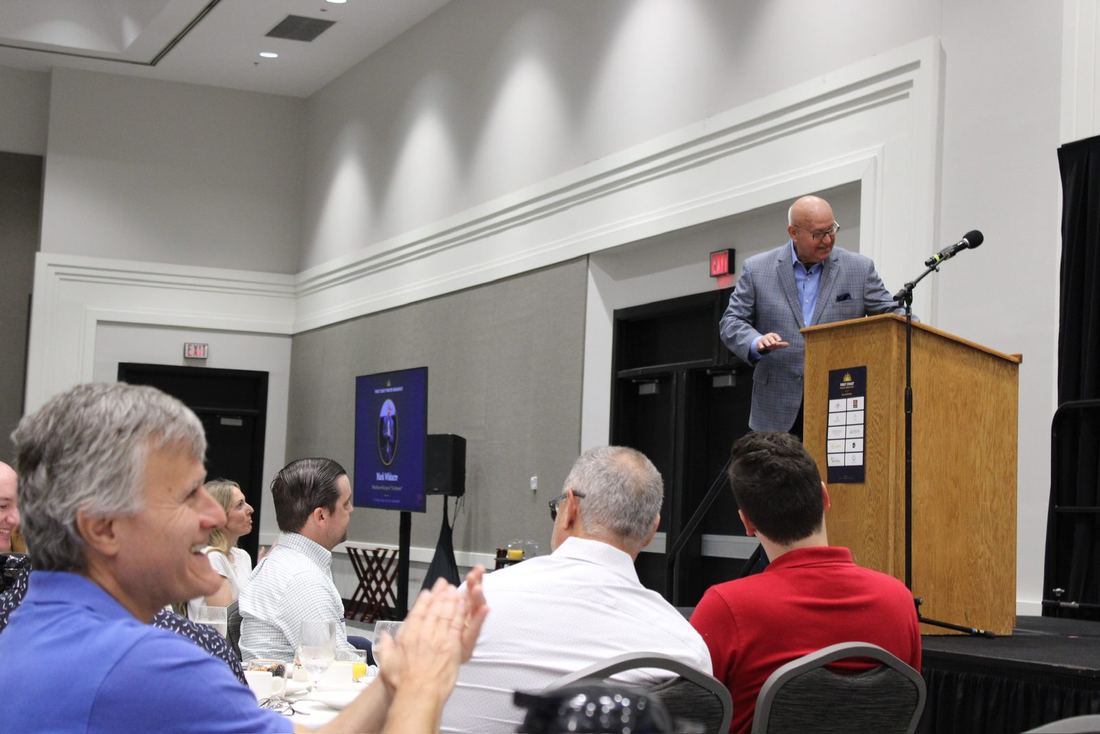 Guests applauding during a speaker's talk